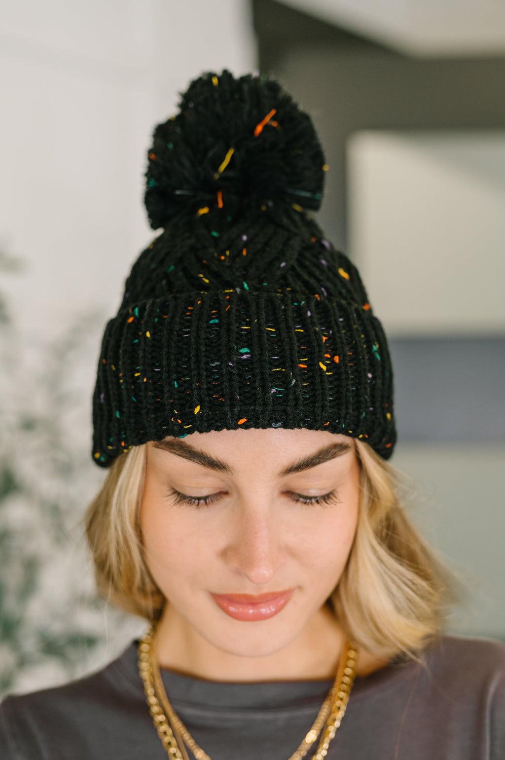 Cover Your Ears Pom Pom Beanie in Black
