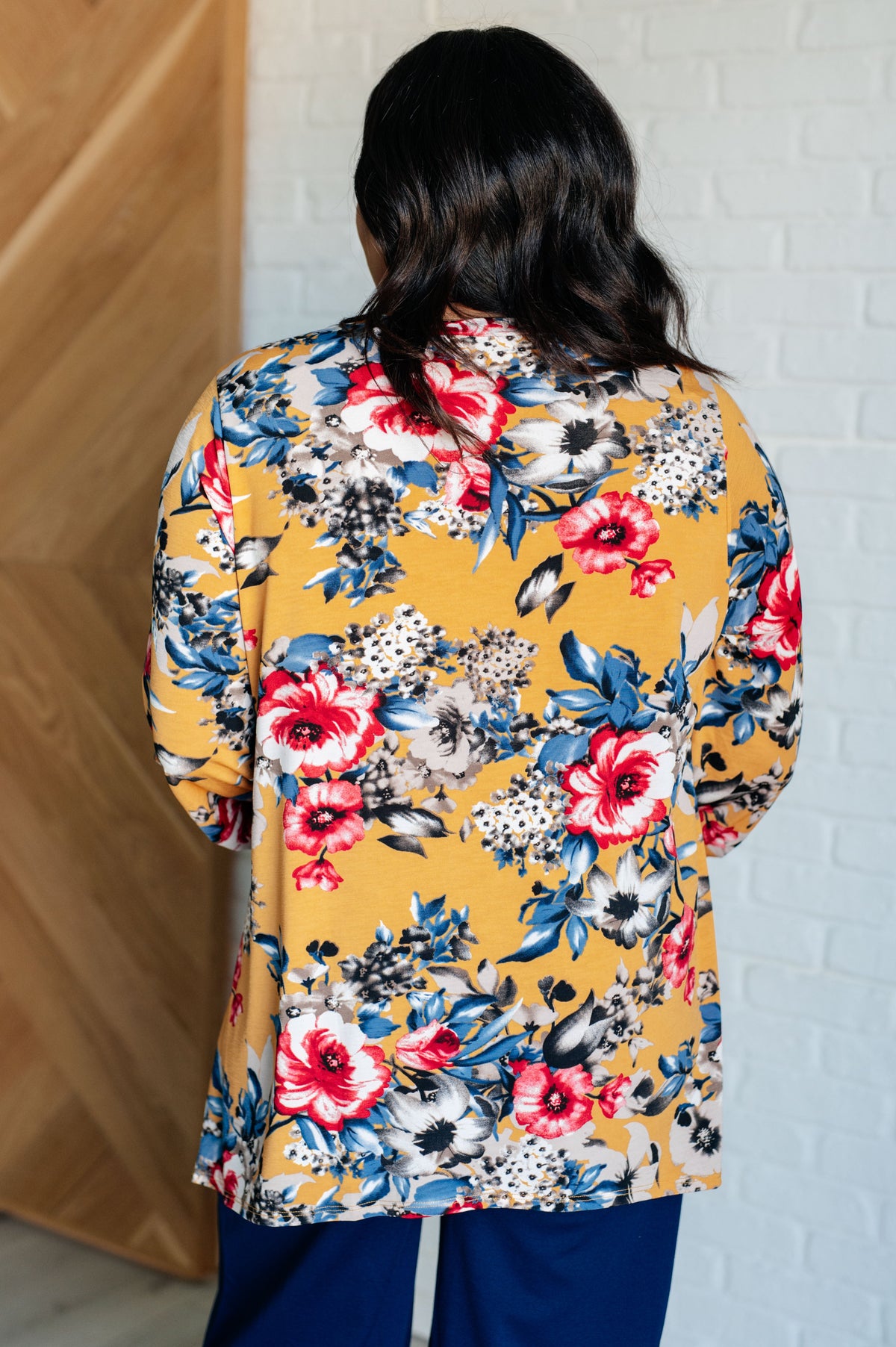 Hazel Blues® |  V-Neck Scoop Hem Top in Marigold Floral