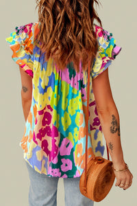 Hazel Blues® |  Ruffled Printed Tie Neck Cap Sleeve Blouse